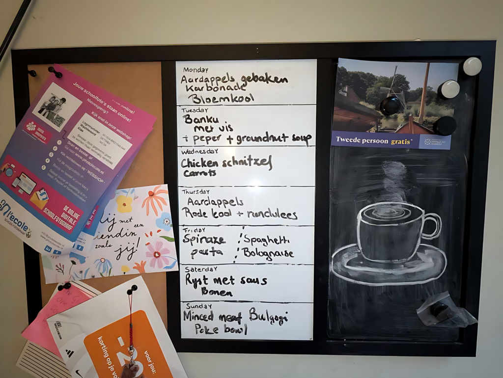 Meal plan written on a whiteboard. Doubles as a board pricker and you black board.